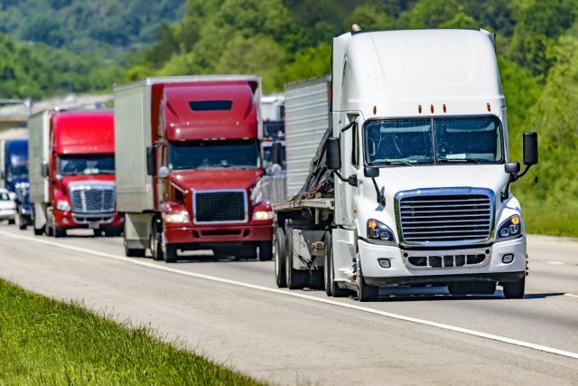 18 wheelers driving representing apportioned vehicles services of notary services company Messenger Service Inc servicing South Hills, PA