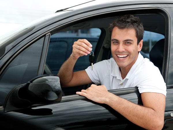 A man sitting inside a car representing vehicle services of vehicle services company Messenger Service Inc servicing Monroeville, PA